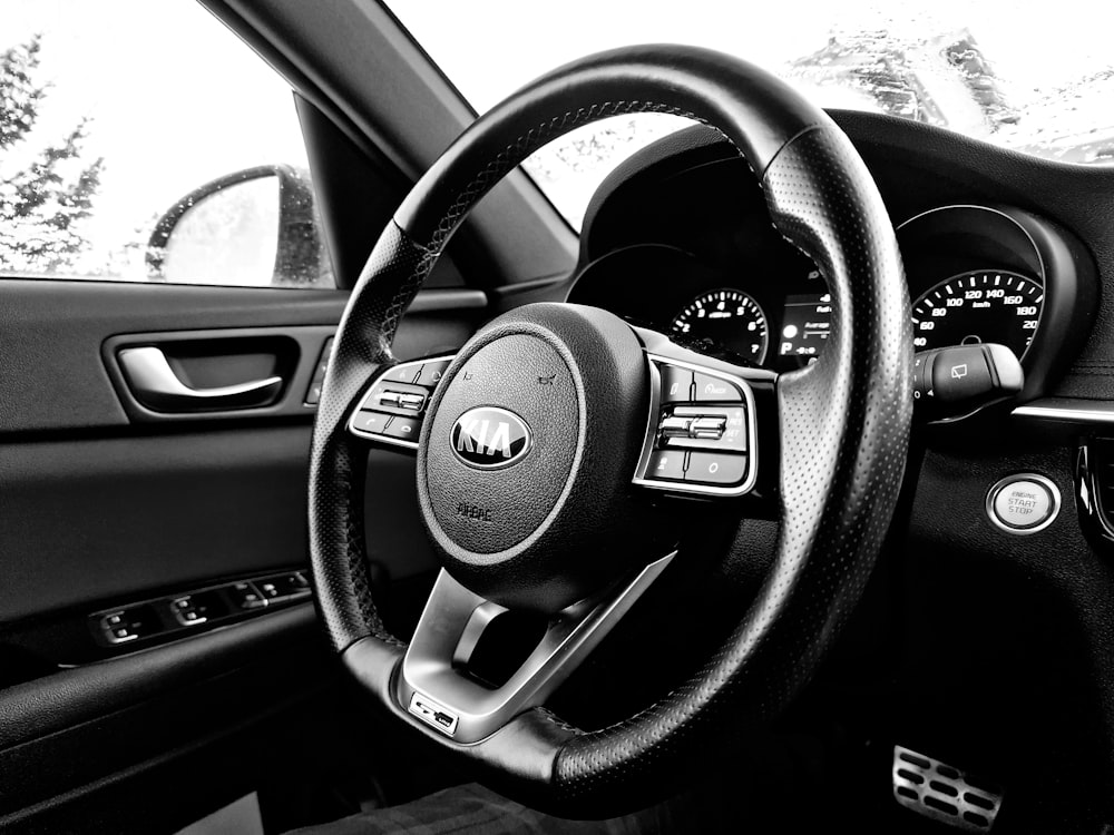 a black and white photo of a car dashboard