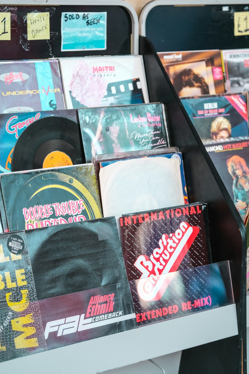 a collection of records are on display in a store