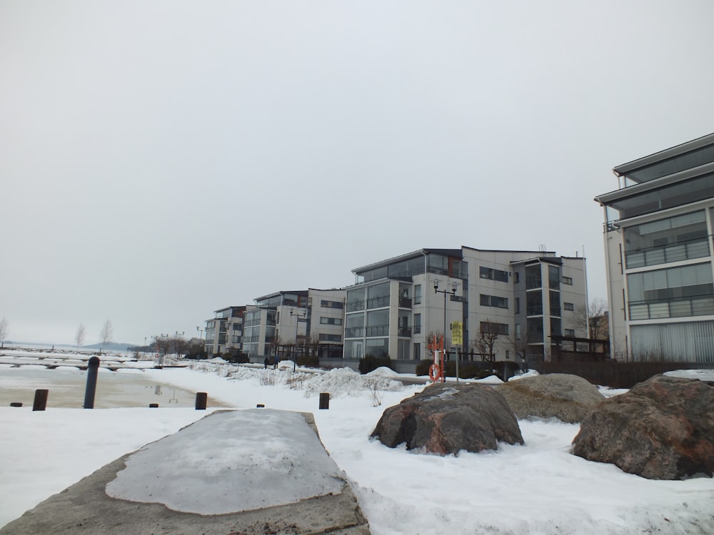 a couple of buildings sitting next to each other in the snow