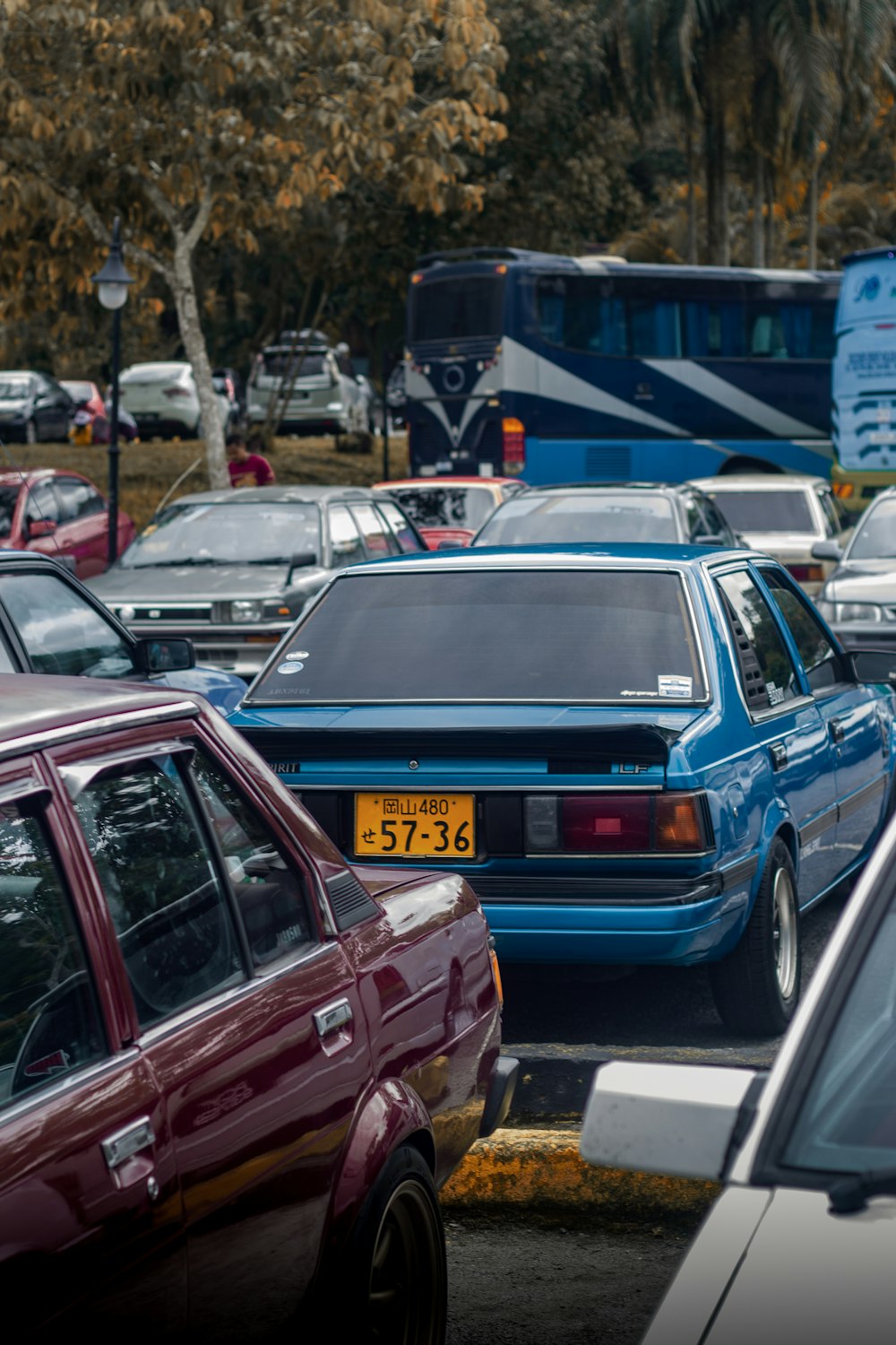 a parking lot filled with lots of parked cars