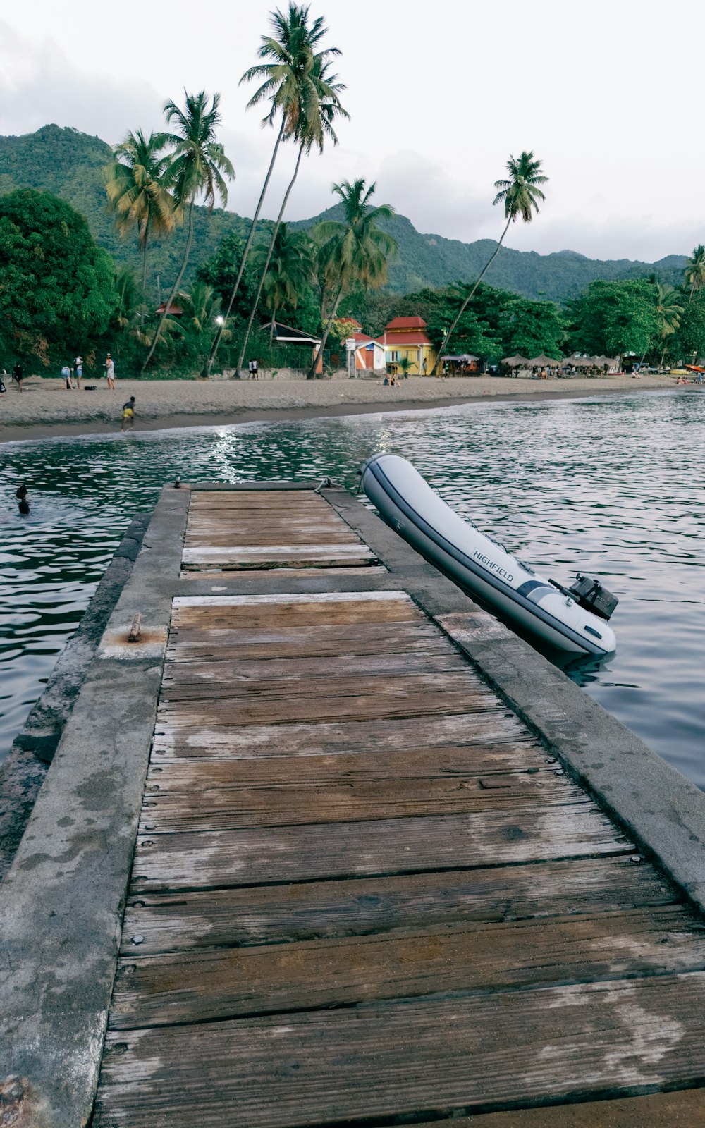 a boat sitting on top of a wooden dock