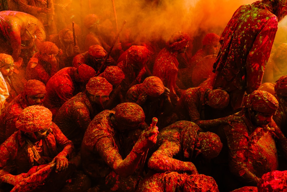 a group of people covered in colored powder