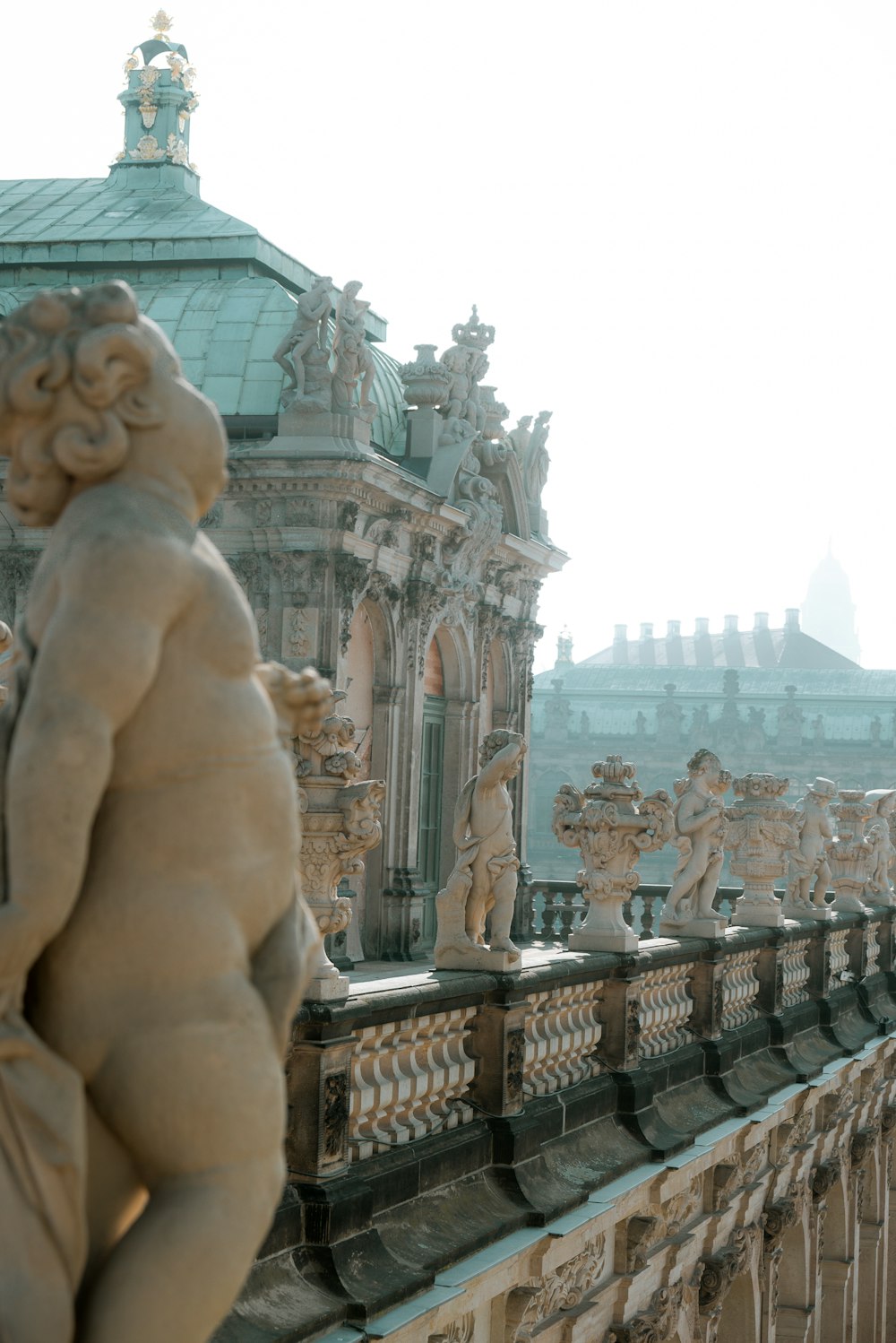 a statue of a woman on a balcony