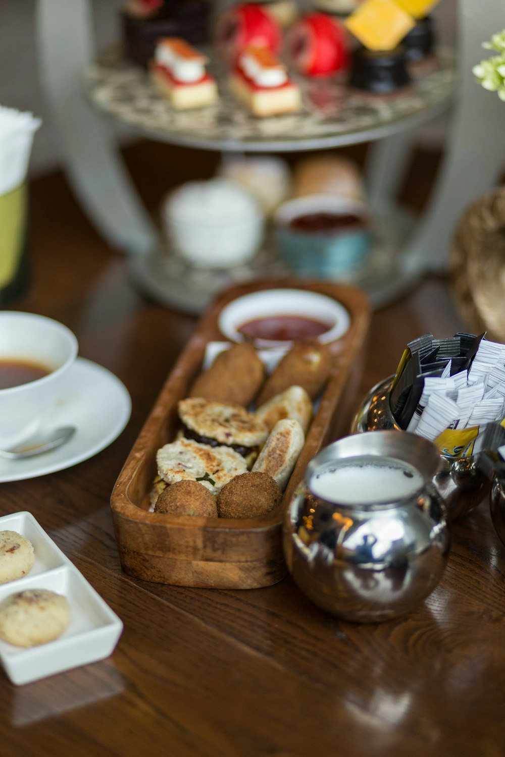 a wooden table topped with plates of food