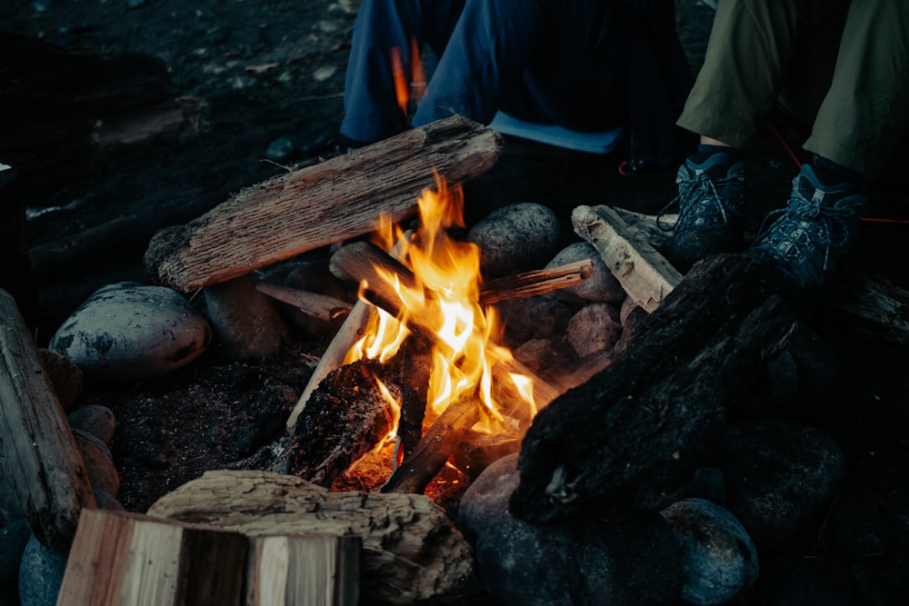 a campfire with people sitting around it