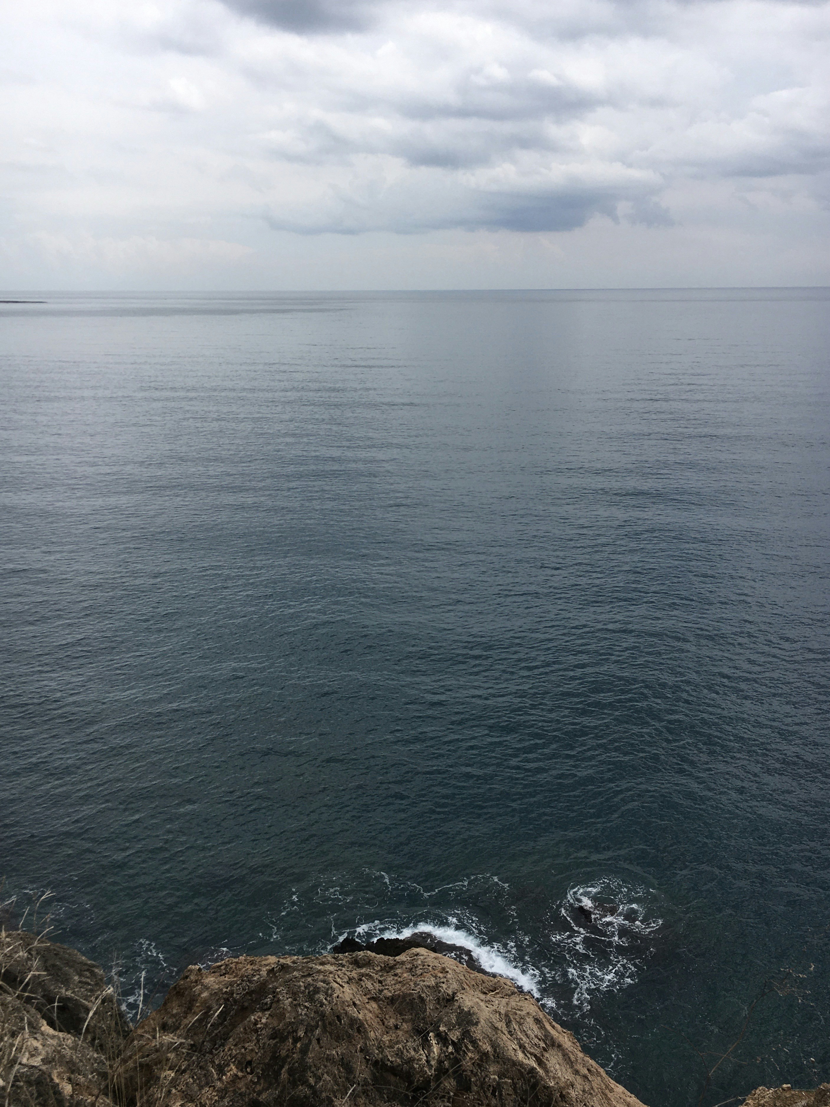 a view of the ocean from a cliff