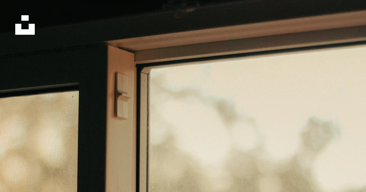 A close up of a window with a handle photo – Free Window Image on Unsplash