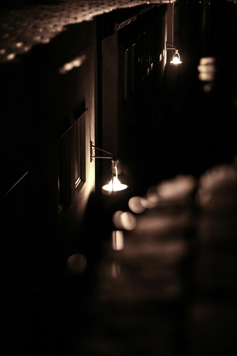 a dimly lit room with candles and a mirror