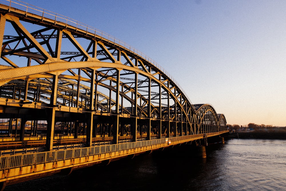 a bridge over a body of water with a sky background