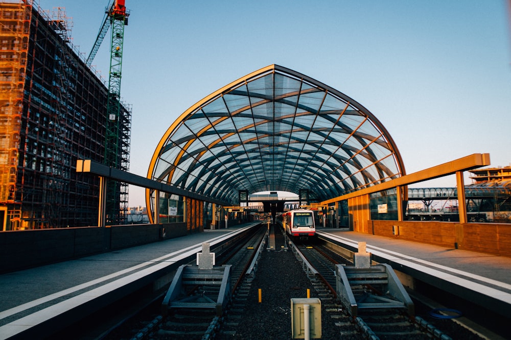 a train station with a train on the tracks