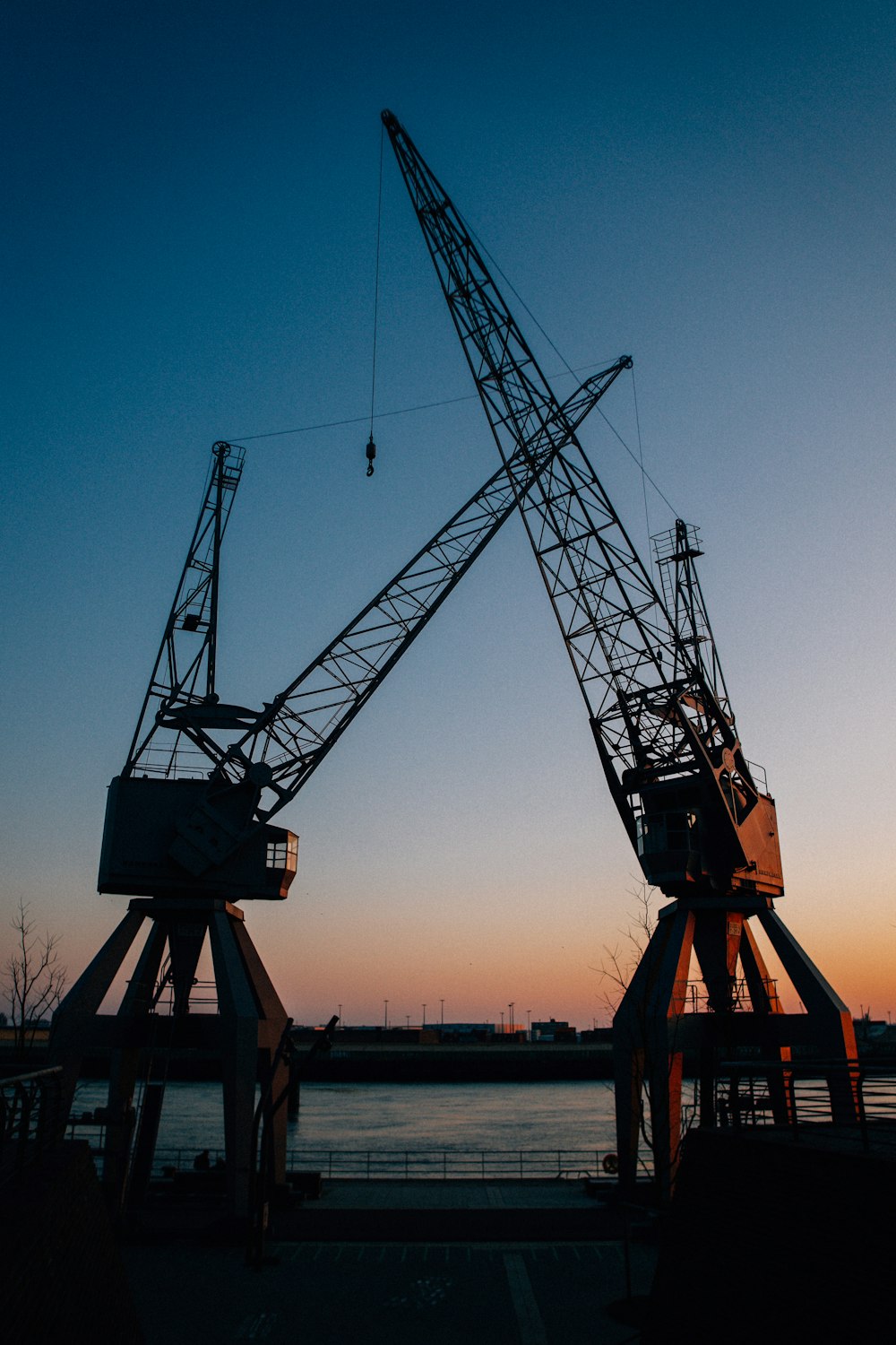 a couple of large cranes sitting next to each other