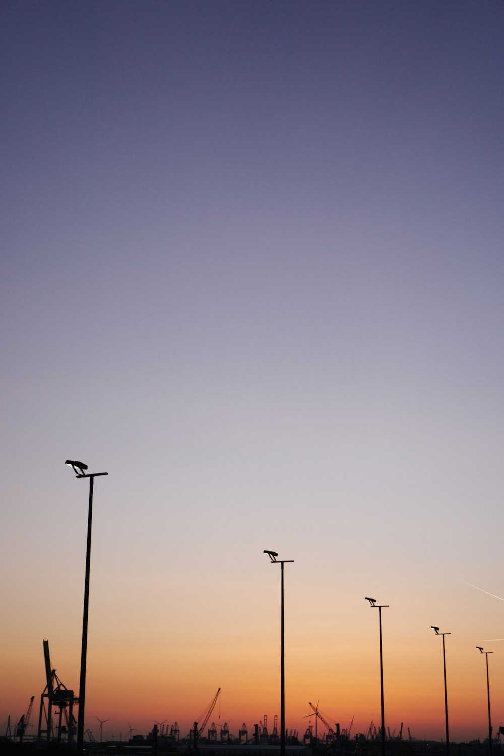 a group of street lights sitting next to each other