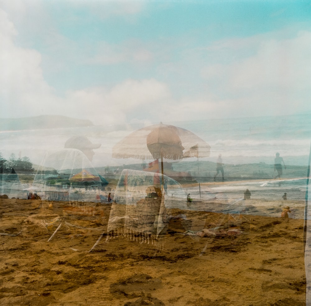 a group of umbrellas sitting on top of a sandy beach