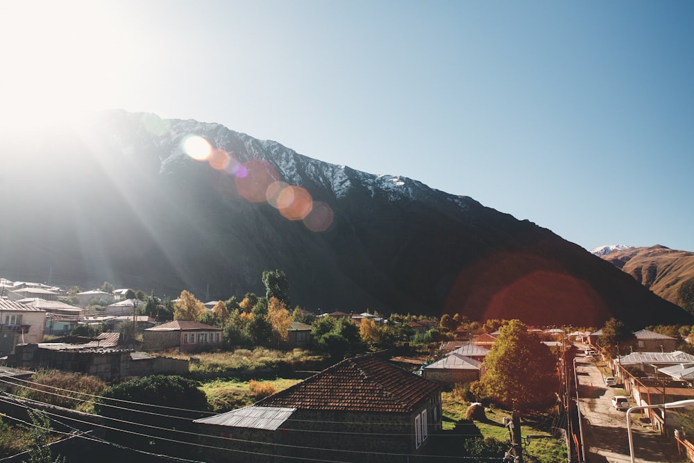 the sun shines brightly over a small town