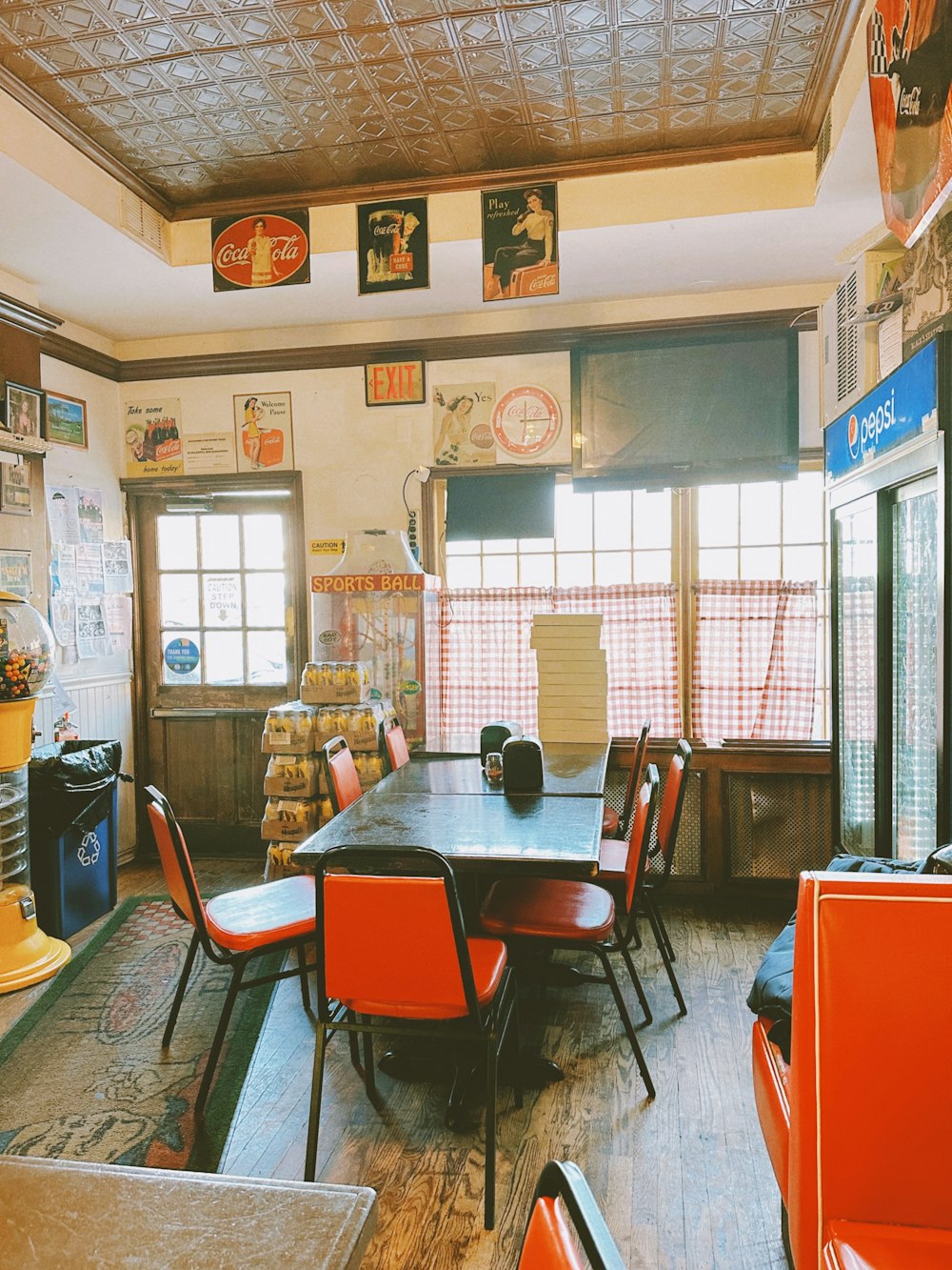 a dining room with a table and chairs