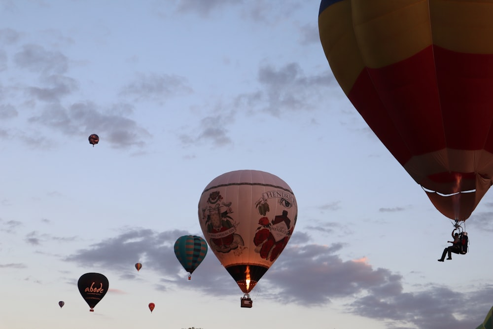 a number of hot air balloons flying in the sky