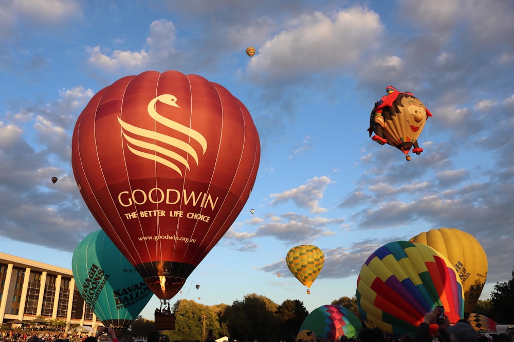 a group of hot air balloons flying in the sky