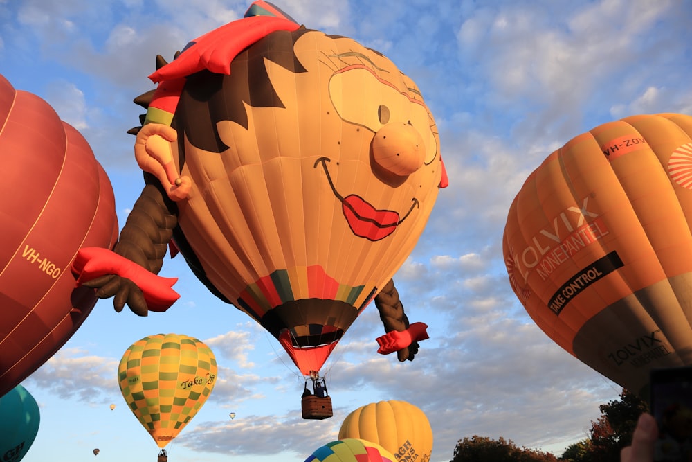 a number of hot air balloons flying in the sky