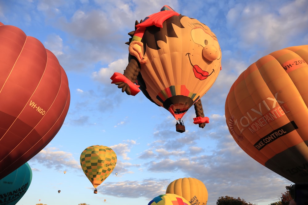 a number of hot air balloons flying in the sky