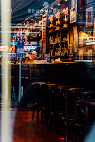 a blurry photo of a bar with stools
