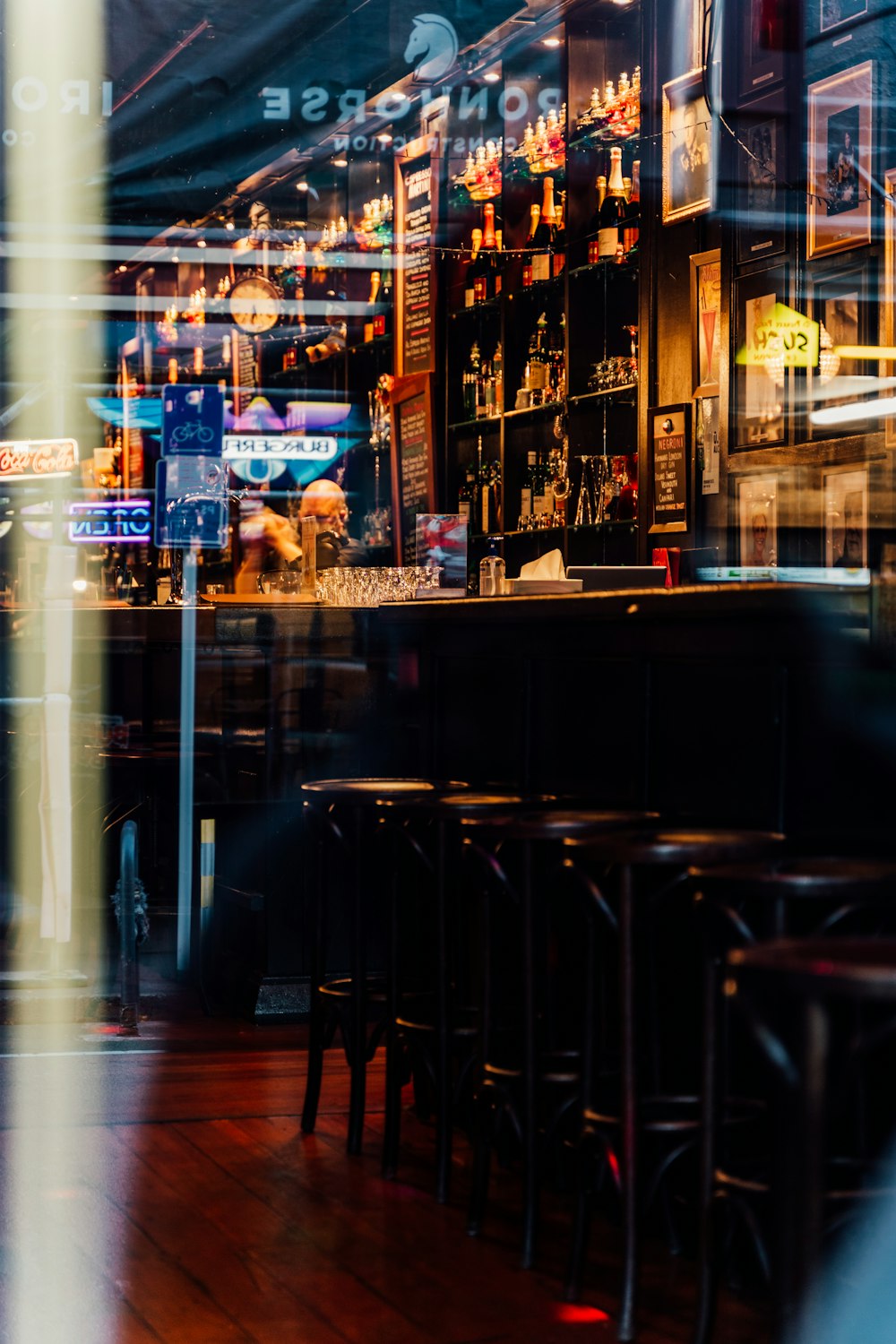 a blurry photo of a bar with stools