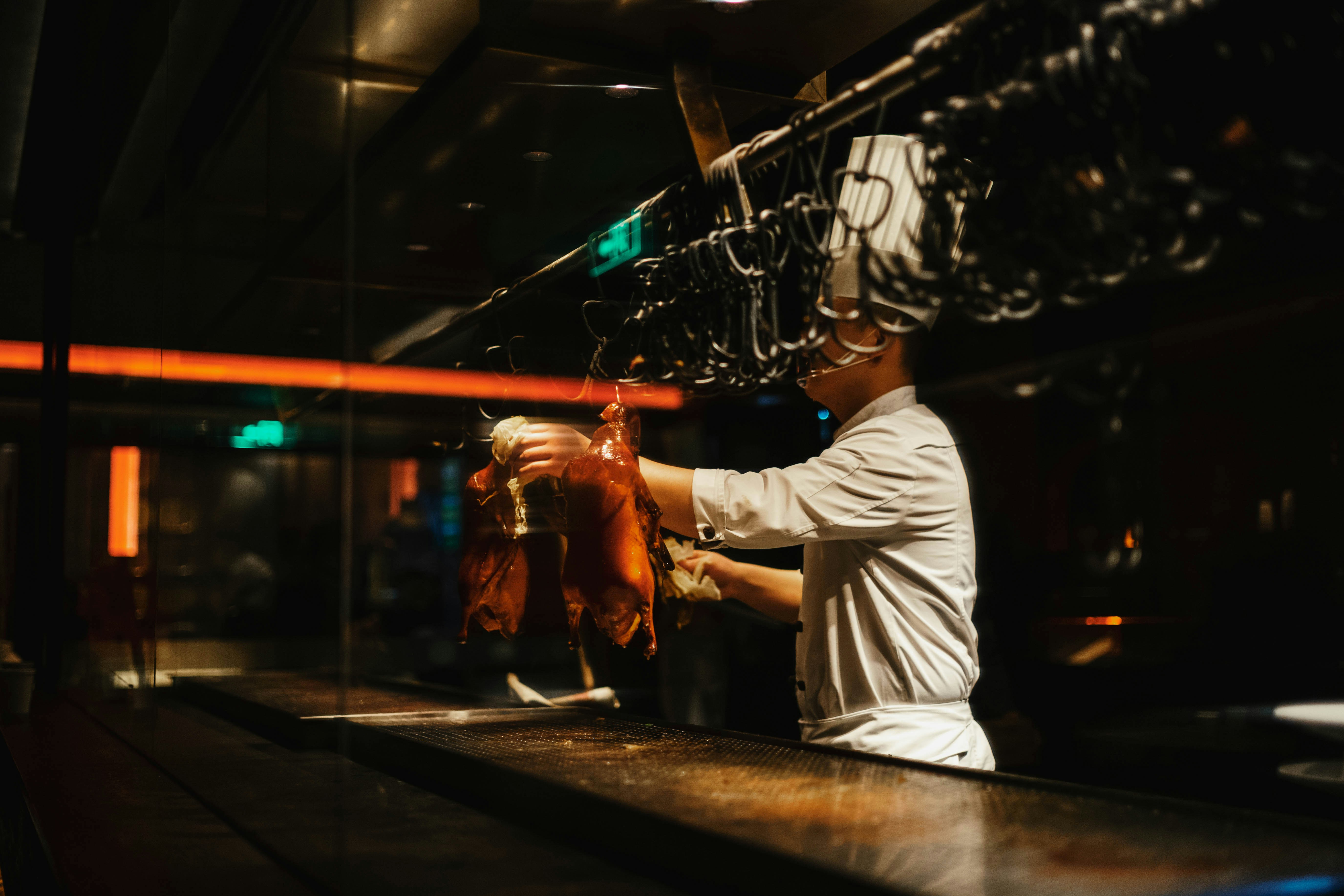 Bartender working at a dark bar