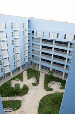 an aerial view of a building with a courtyard