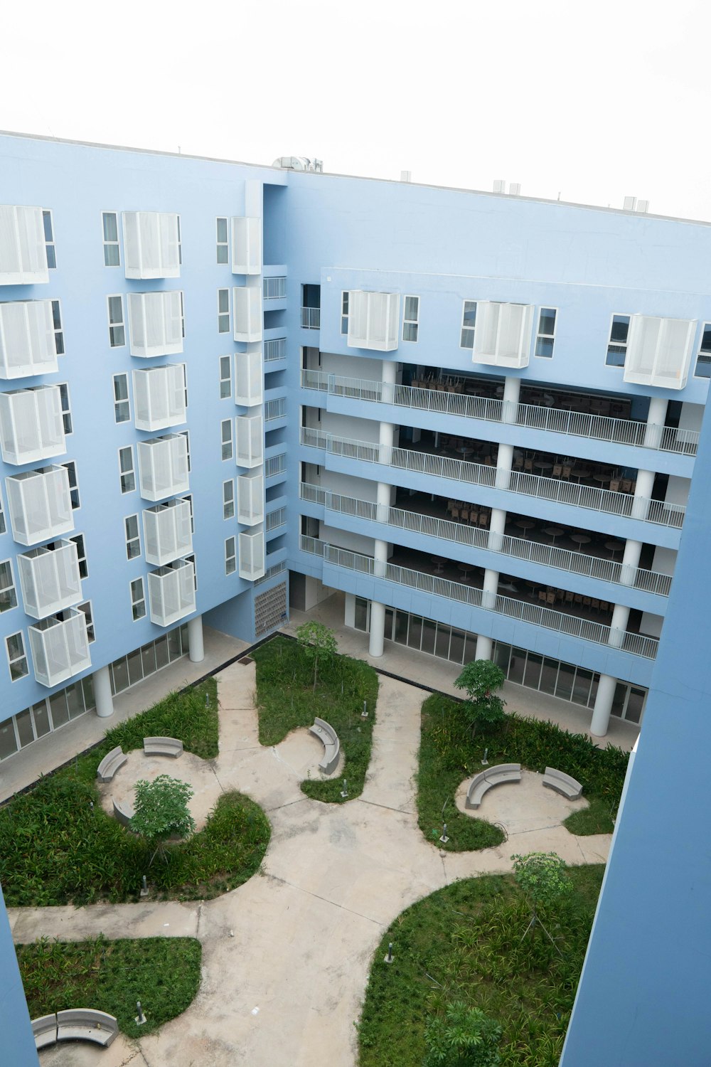 an aerial view of a building with a courtyard