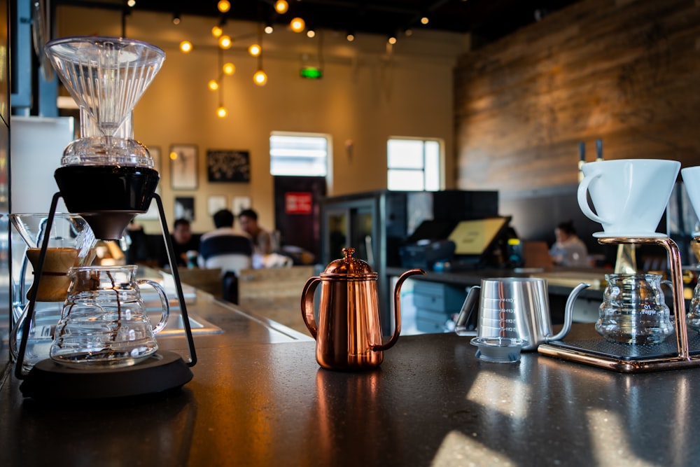 a coffee maker sitting on top of a wooden table