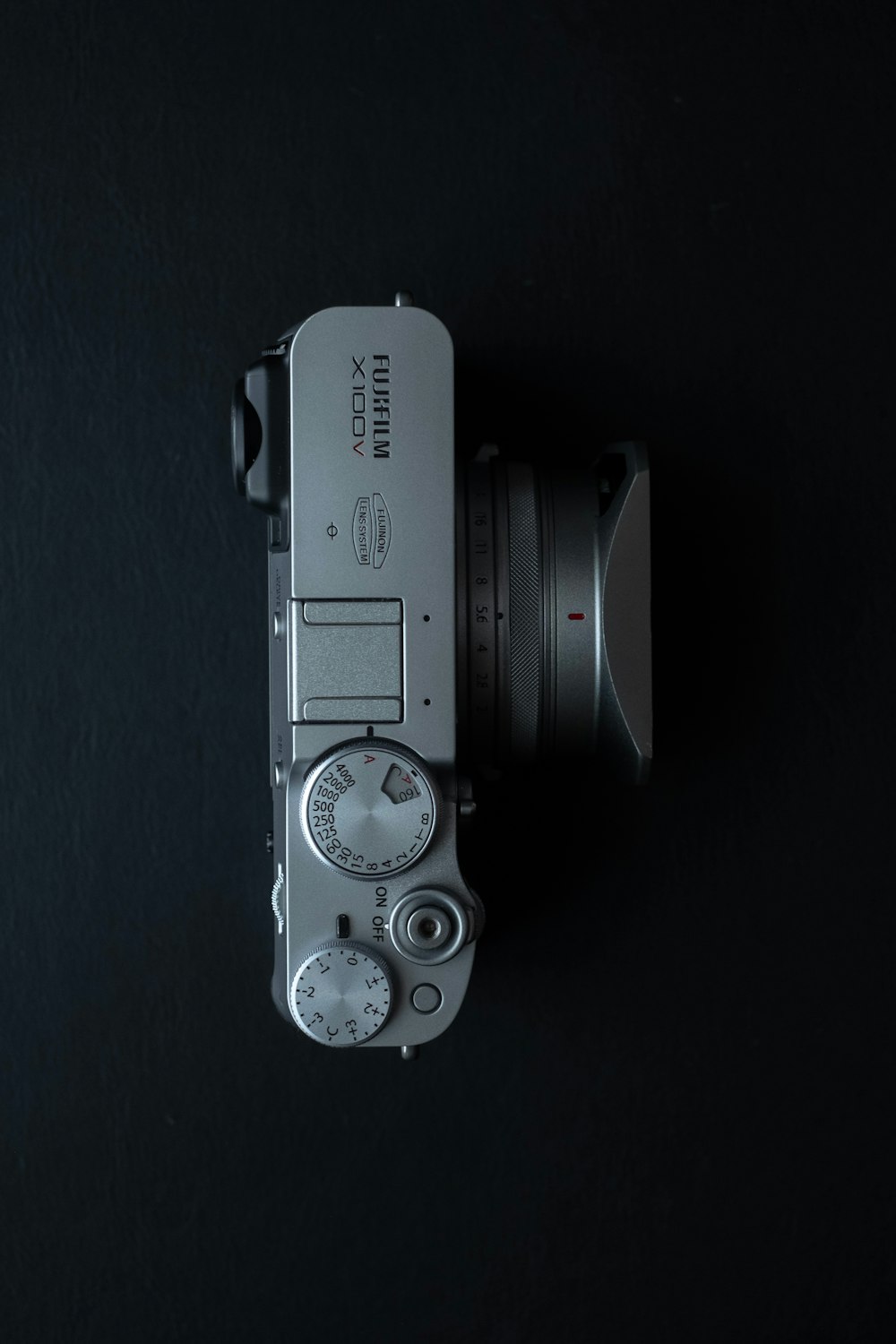 a close up of a camera on a black background