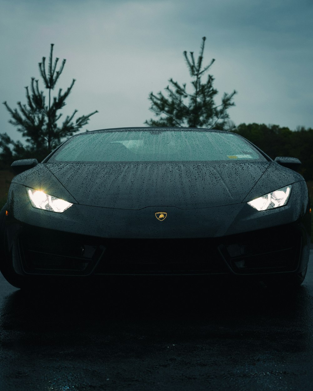 a black sports car parked in a parking lot