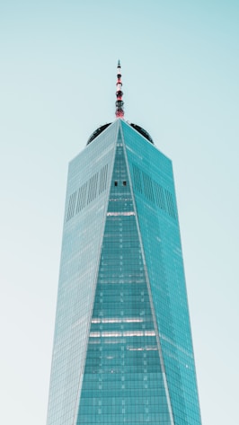 a very tall building with a sky background