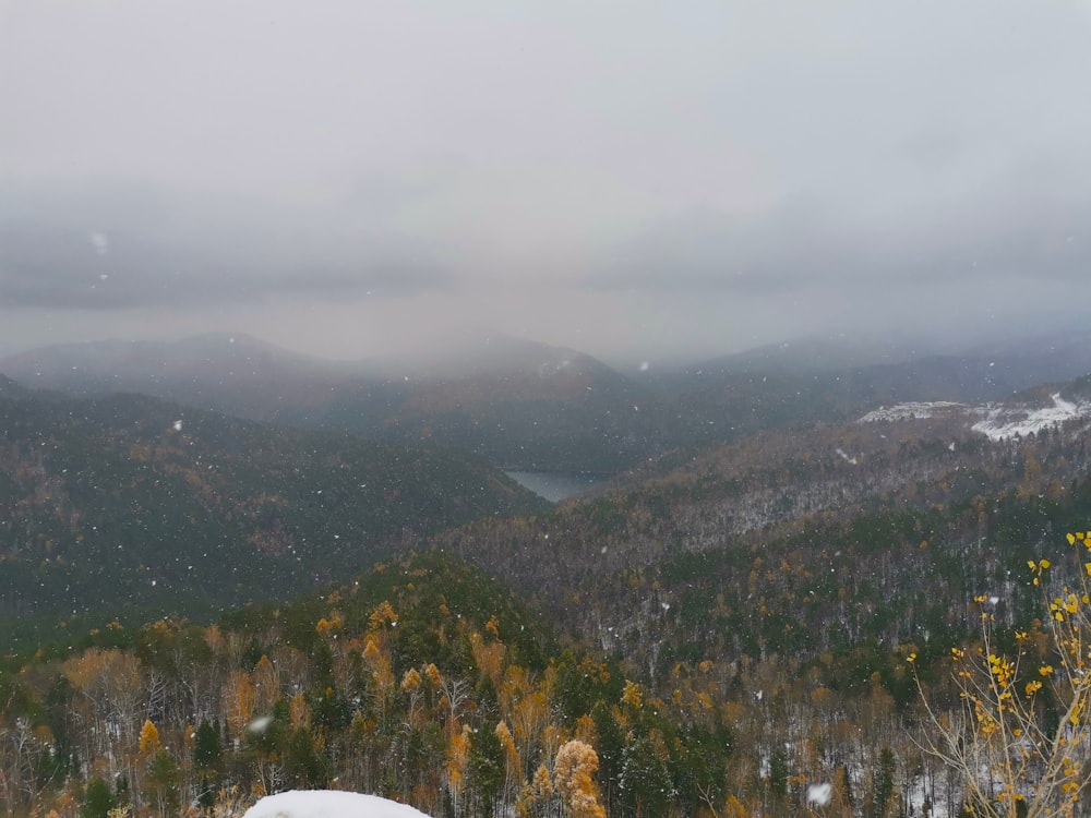 a person standing on top of a snow covered slope