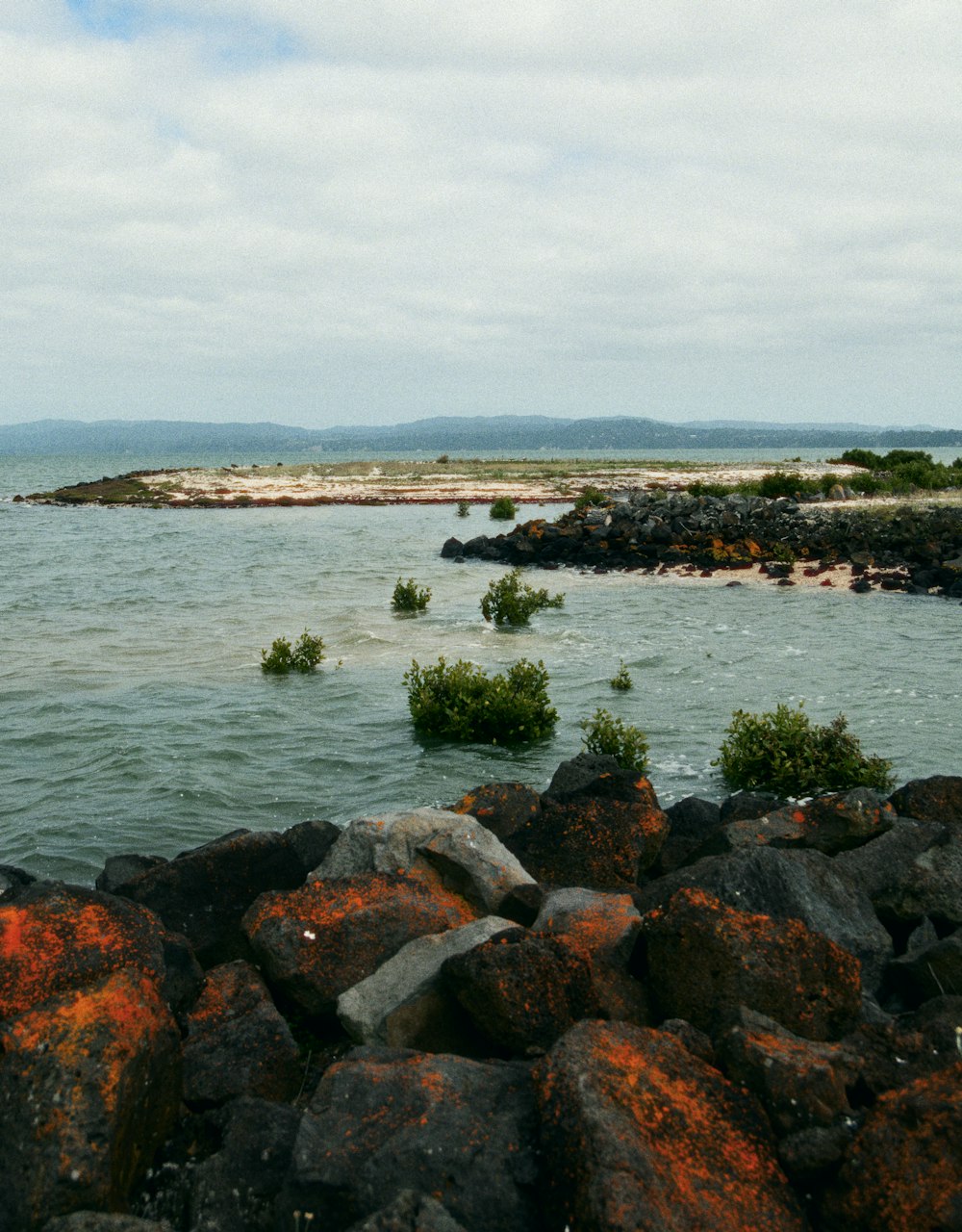 a large body of water surrounded by rocks