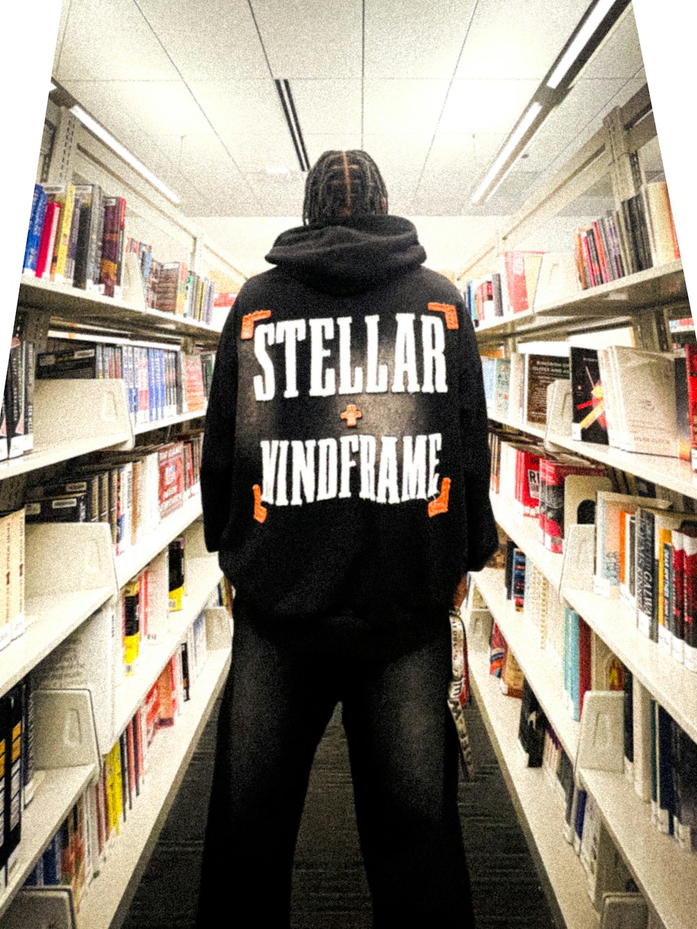 a person standing in front of a book shelf