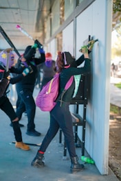a group of people standing next to each other near a building