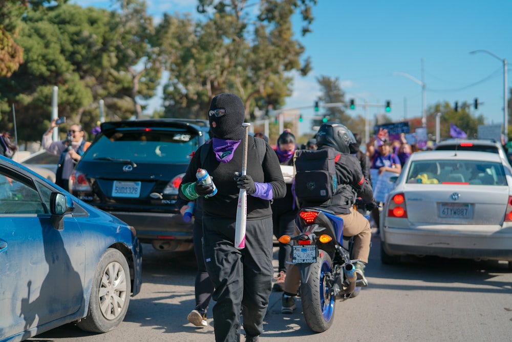 a group of people riding motorcycles down a street