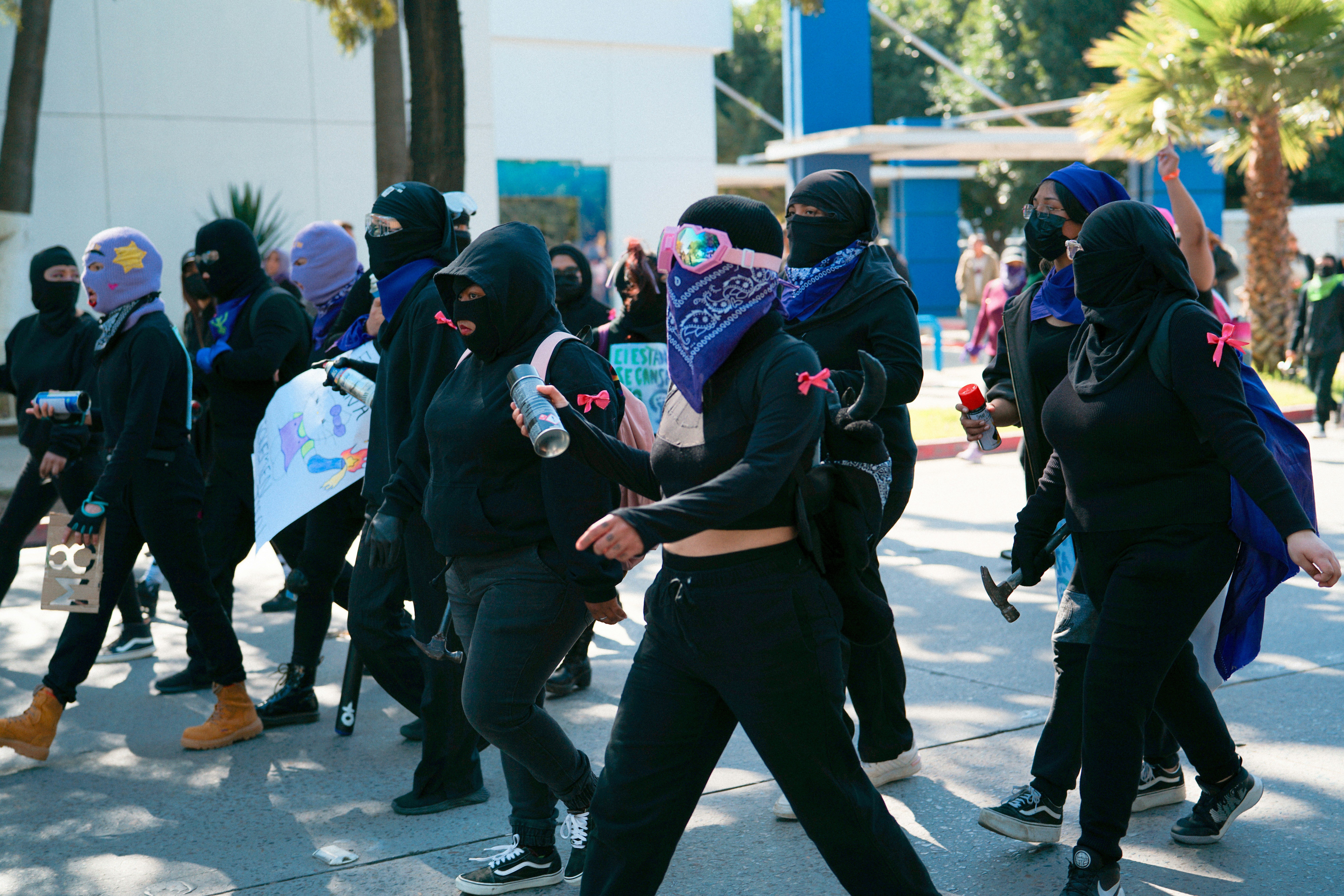 a group of people walking down a street