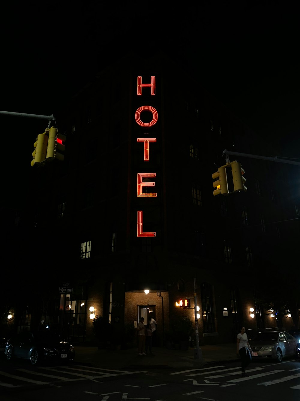 a large hotel sign lit up at night