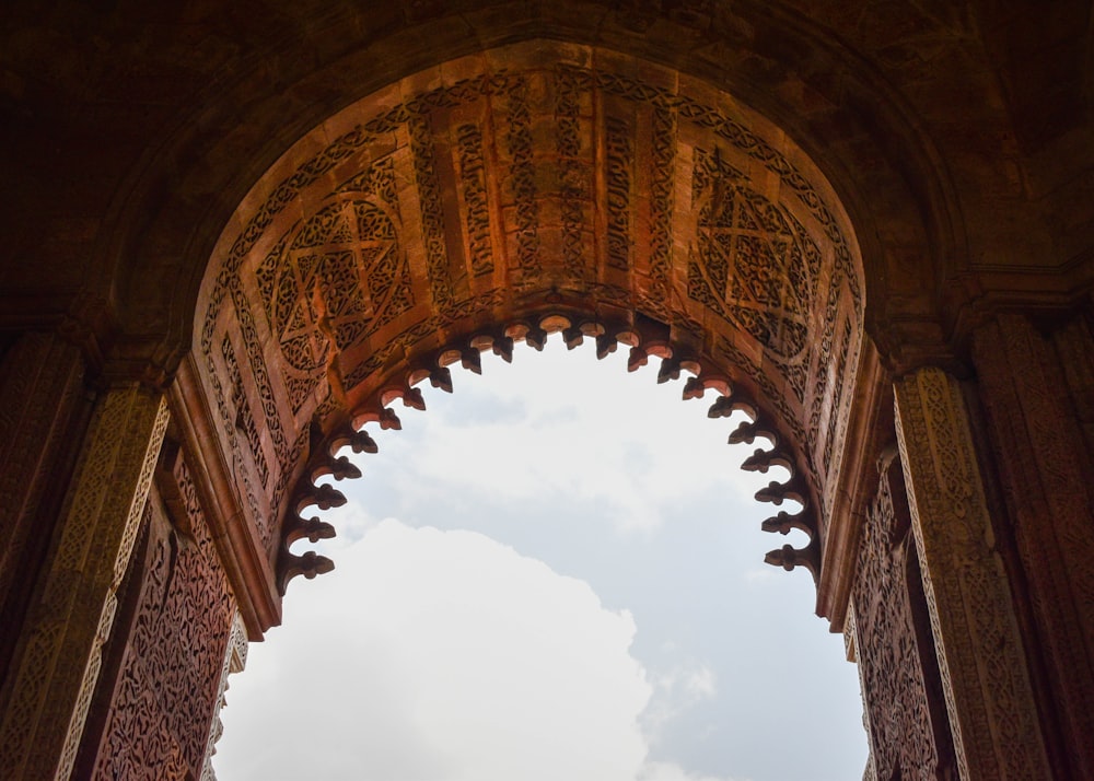 a view of the sky through an arch in a building