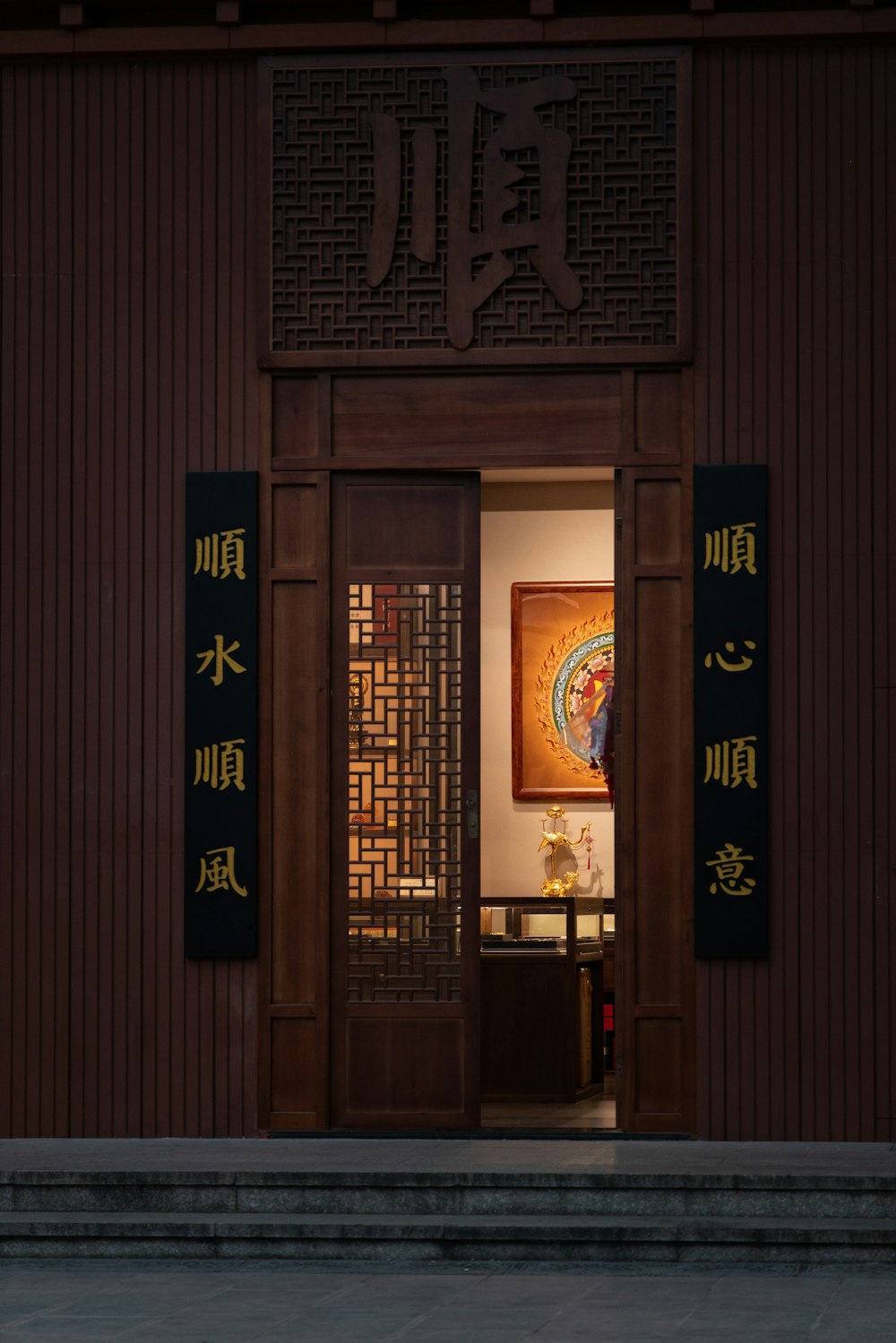 a person walking into a building with a clock on the wall