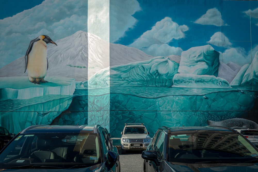 a mural of a penguin on the side of a building