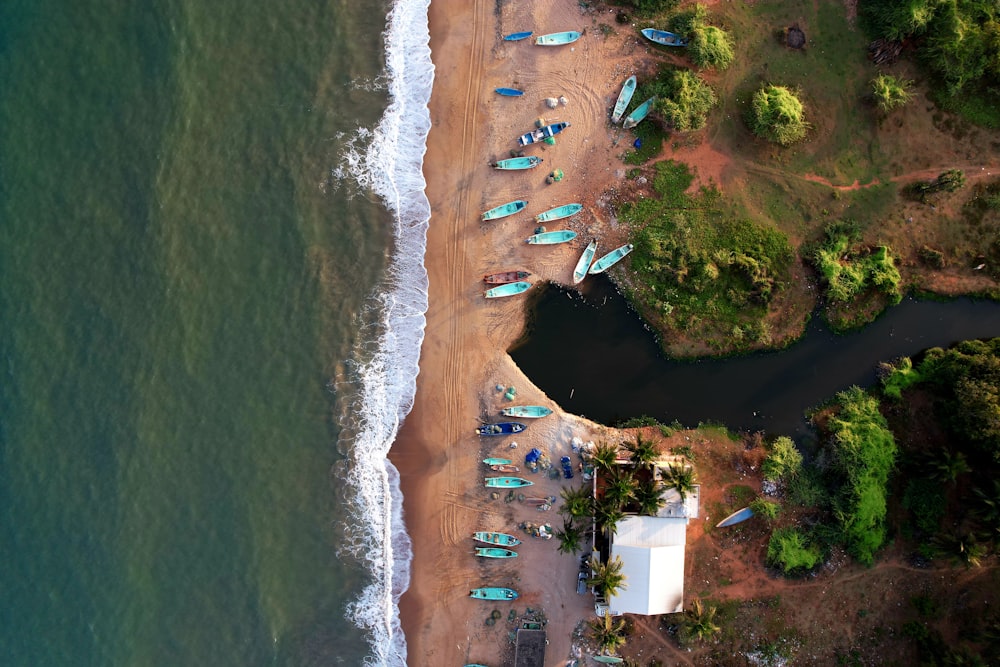 an aerial view of a beach with a lot of boats