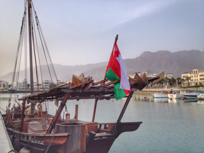 a large boat with a flag on top of it