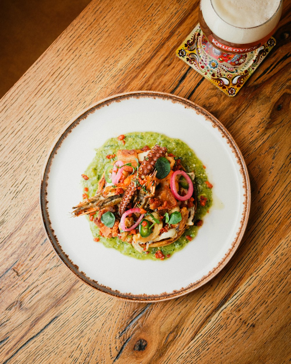 a plate of food on a wooden table