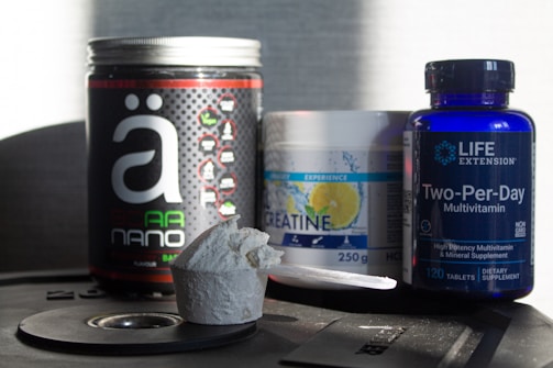 a table topped with bottles of vitamins and pills