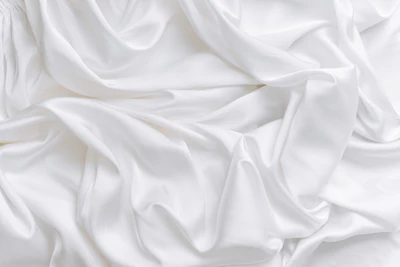 Stock photo: ivory textile drape — lace-adjacent texture reference (illustrative only)