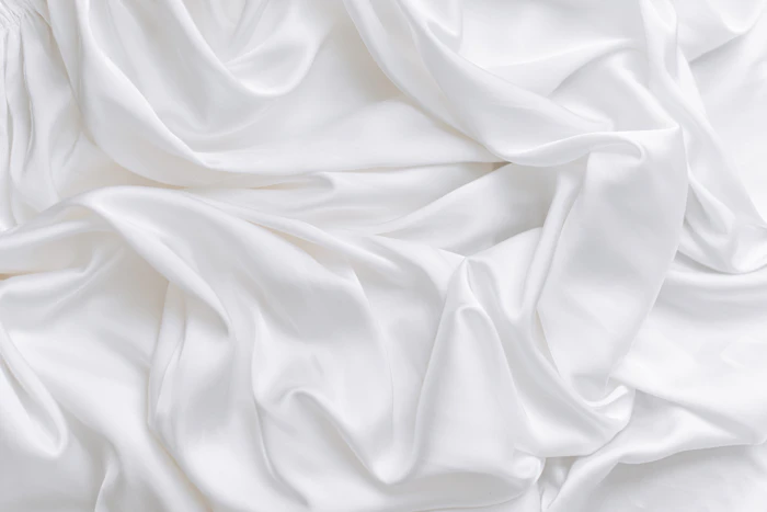Fabric detail: structured white textile drape