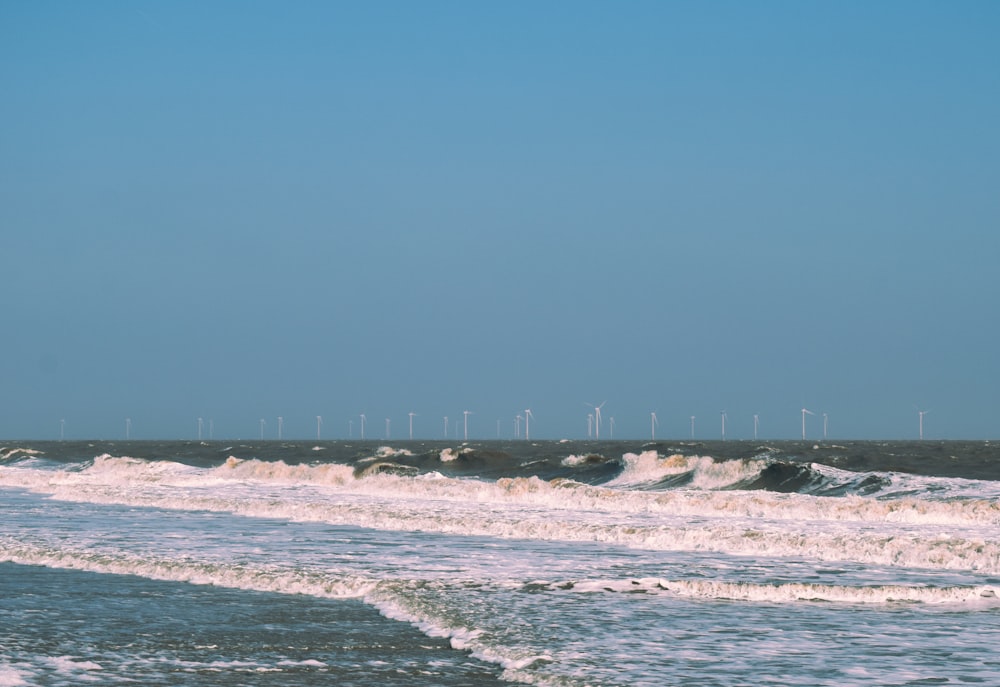 a person riding a surfboard on a wave in the ocean