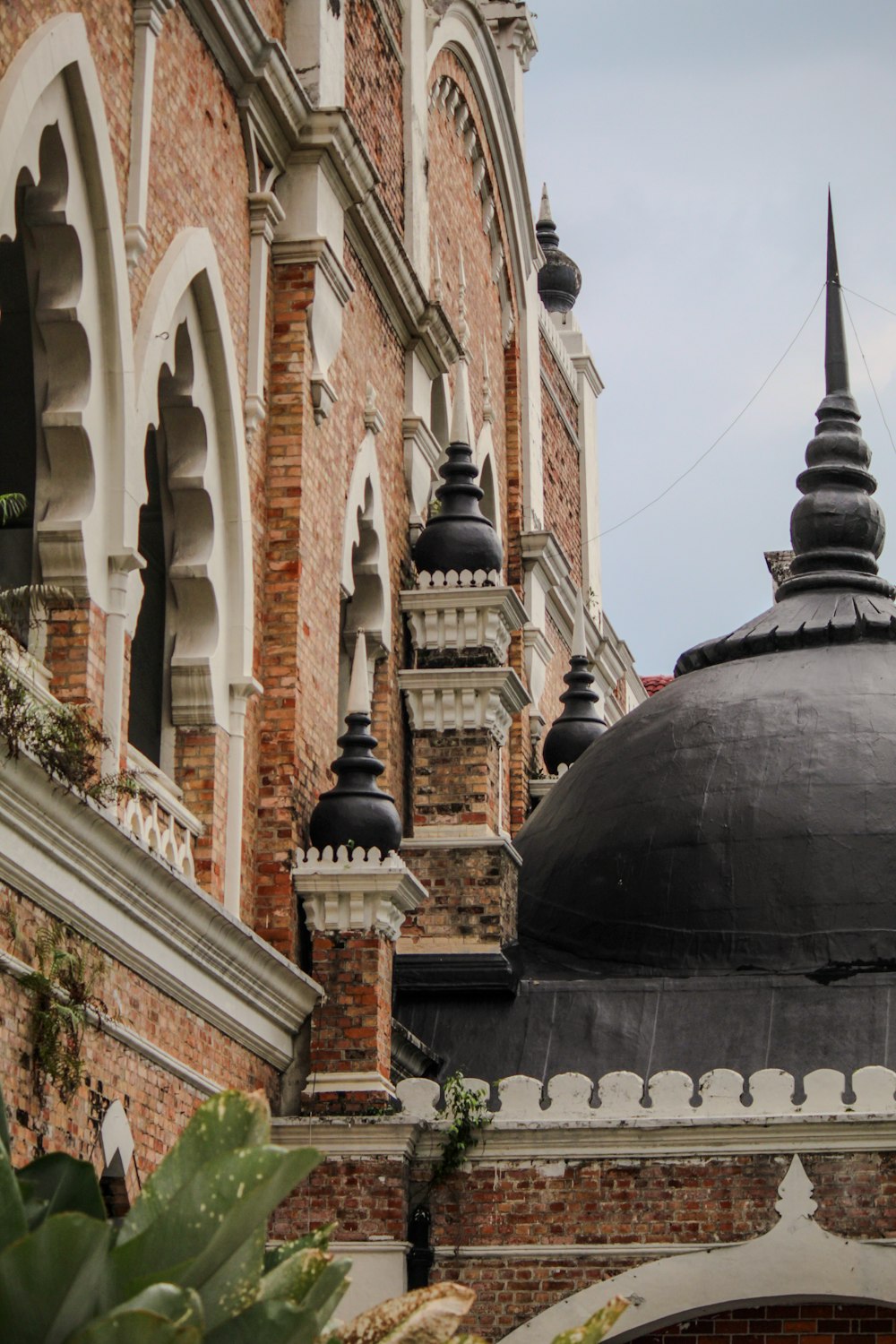 a large building with a black dome on top of it